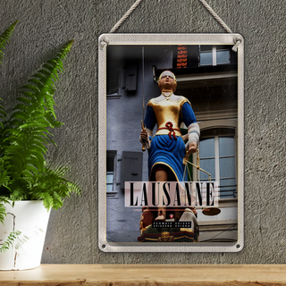 Blechschild Reise 20x30cm Lausanne Schweiz Skulptur Frau Waage