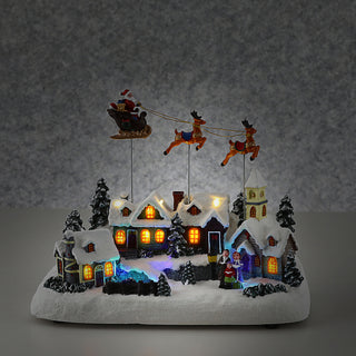 LED Winterlandschaft fliegender Santa Schlitten 29x22cm Polyresin bunte LEDs batteriebetrieben An-/Ausschalter Weihnachtsdekoration