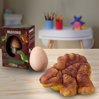 Magischer Dino im Ei 12 Stück im Display 7,5x10,5x5cm Kunststoff 6 Motive schlüpfende Dinos magisch Spielfigur